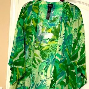 Multi color green short kimono. Has some purple through out it. NWOT